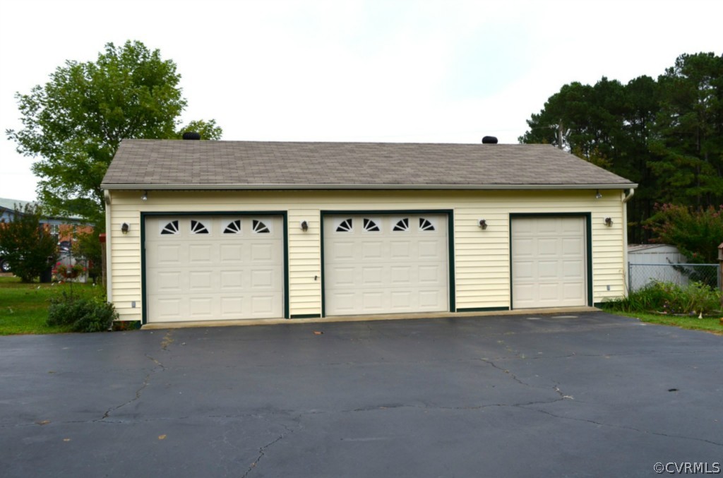 7601 Strath Road Henrico, VA 23231 - Photo 3 of 17 a view of a house with a outdoor space and garage