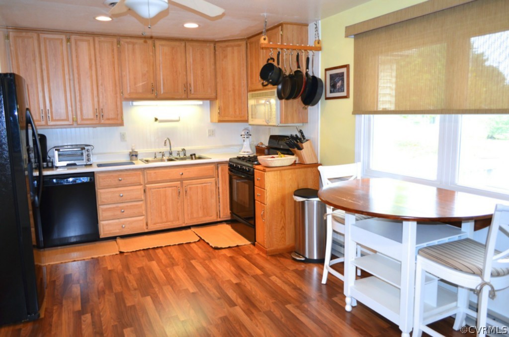 7601 Strath Road Henrico, VA 23231 - Photo 8 of 17 a kitchen with stainless steel appliances granite countertop a sink a stove and a refrigerator