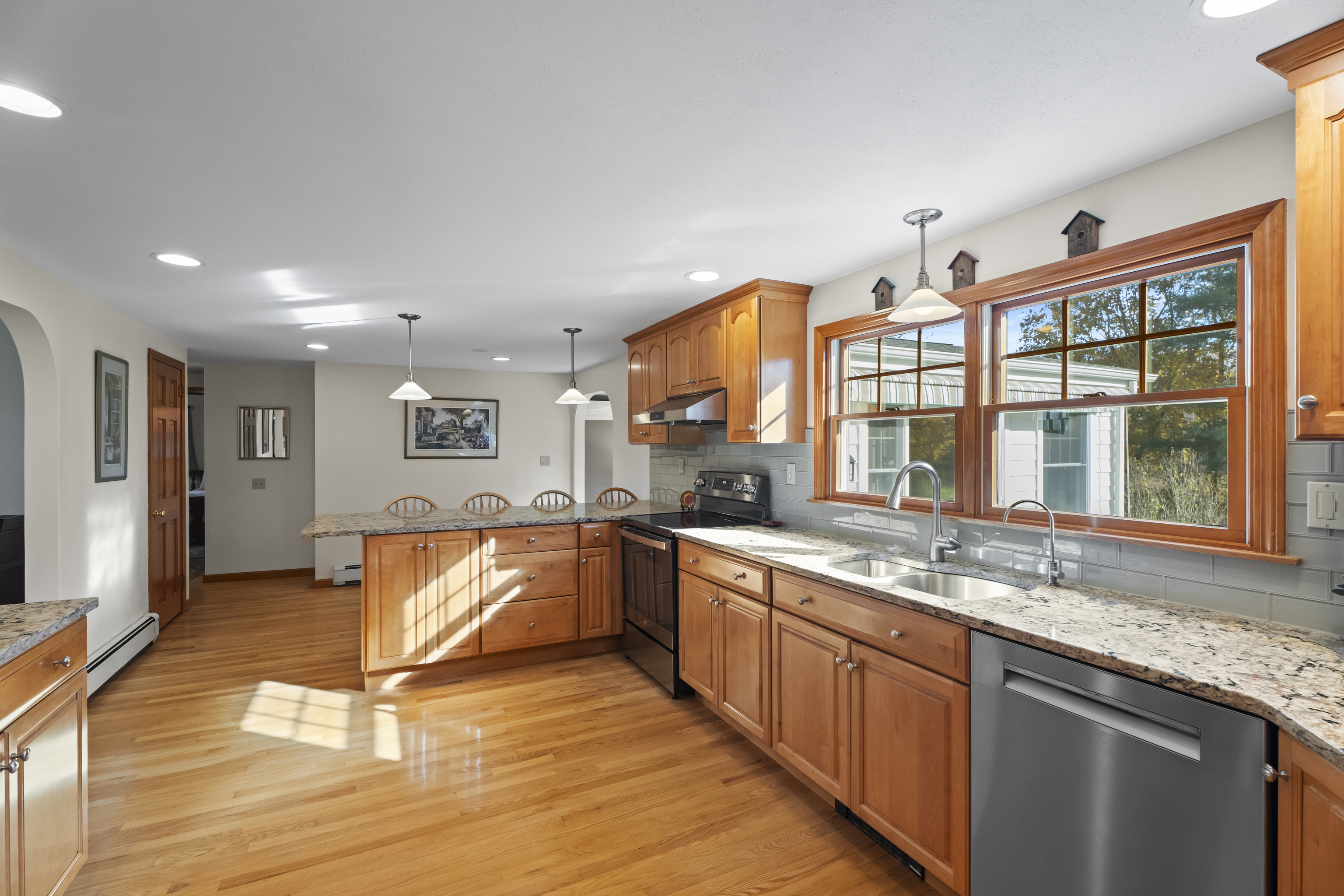 452 Colonel Ledyard Highway Ledyard, CT 06339 - Photo 11 of 35 a large kitchen with stainless steel appliances granite countertop a stove and a sink