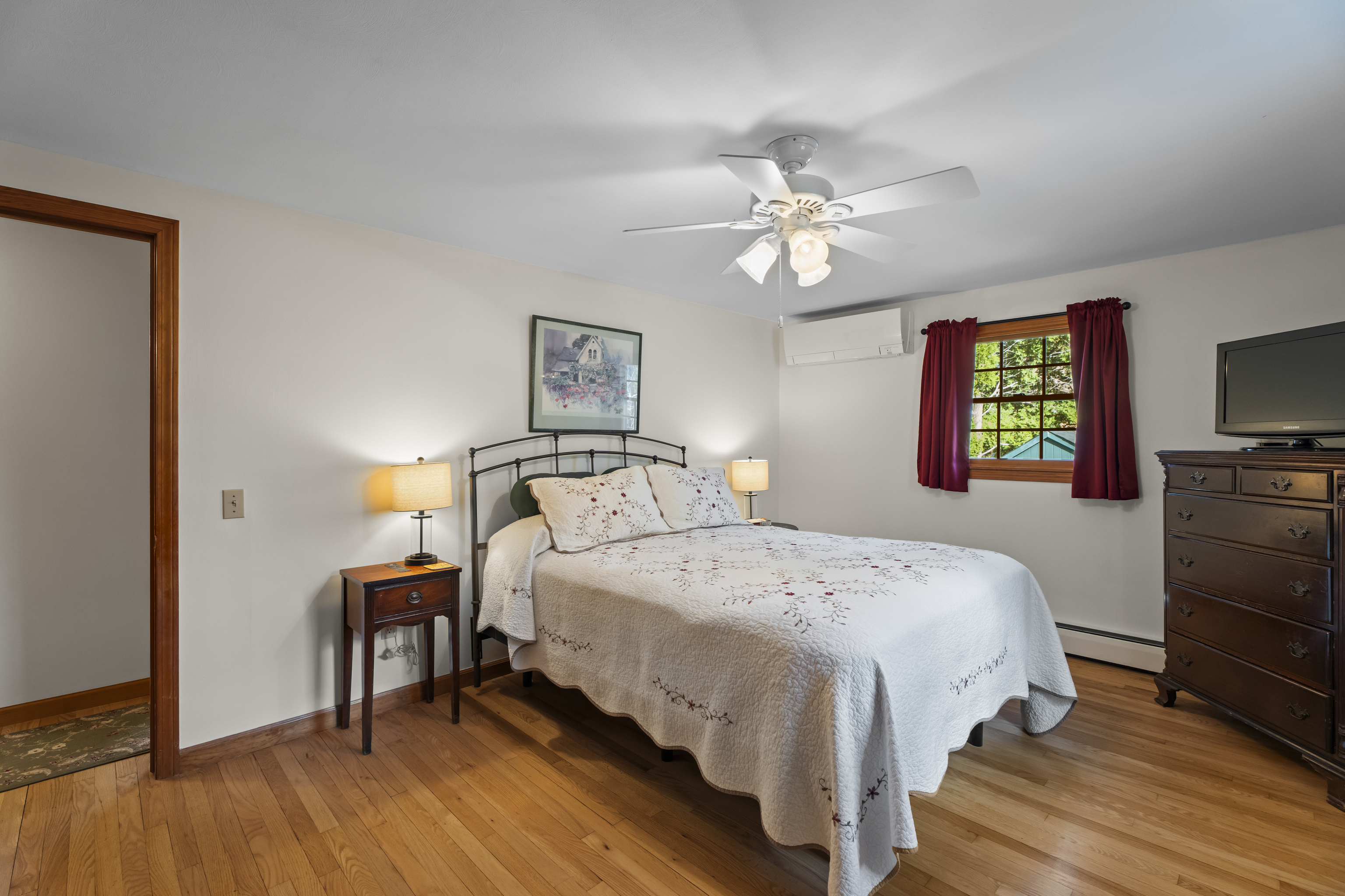 452 Colonel Ledyard Highway Ledyard, CT 06339 - Photo 19 of 35 a bedroom with a bed and a flat screen tv