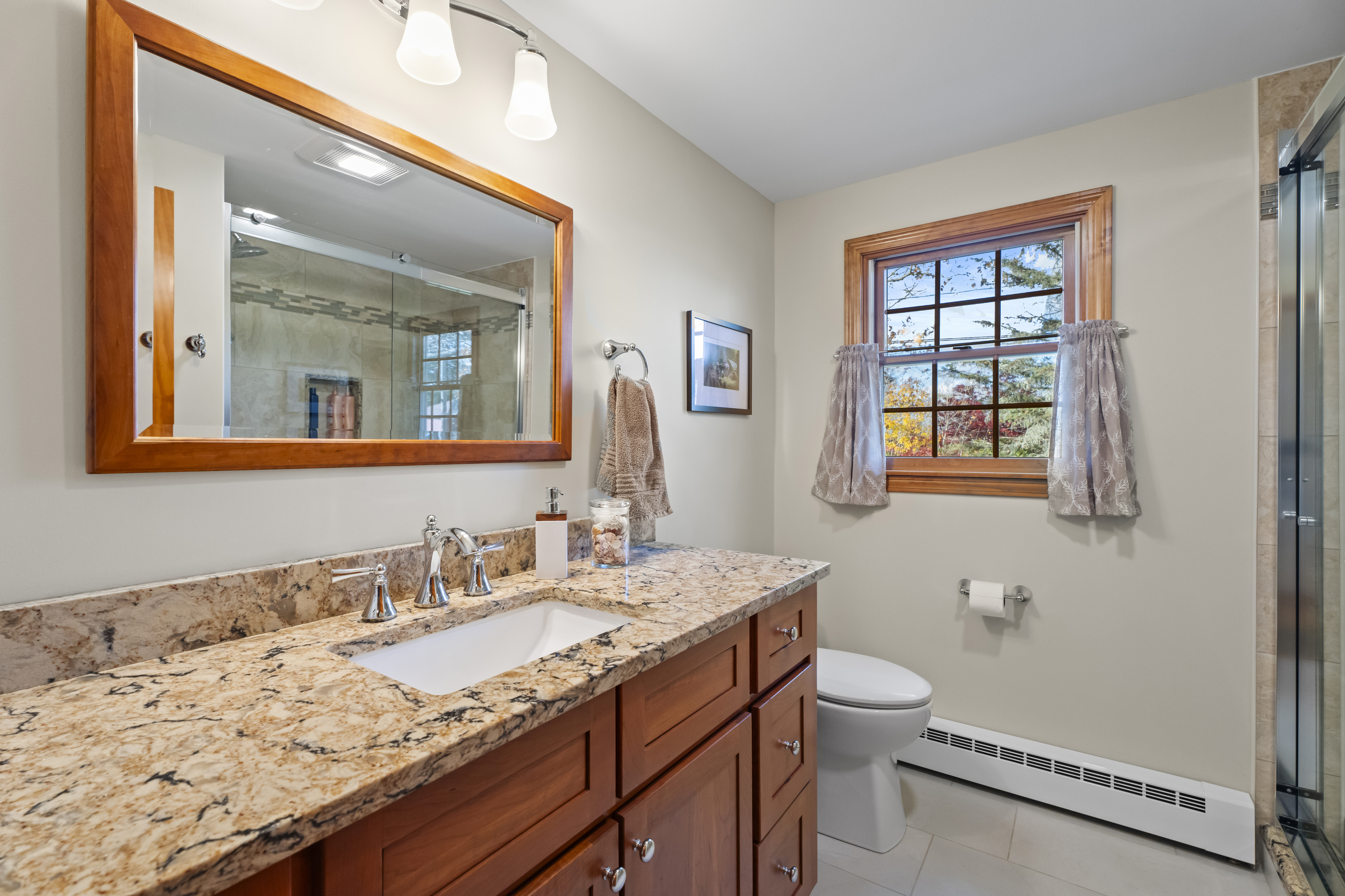 452 Colonel Ledyard Highway Ledyard, CT 06339 - Photo 20 of 35 a bathroom with a granite countertop sink a toilet and a mirror