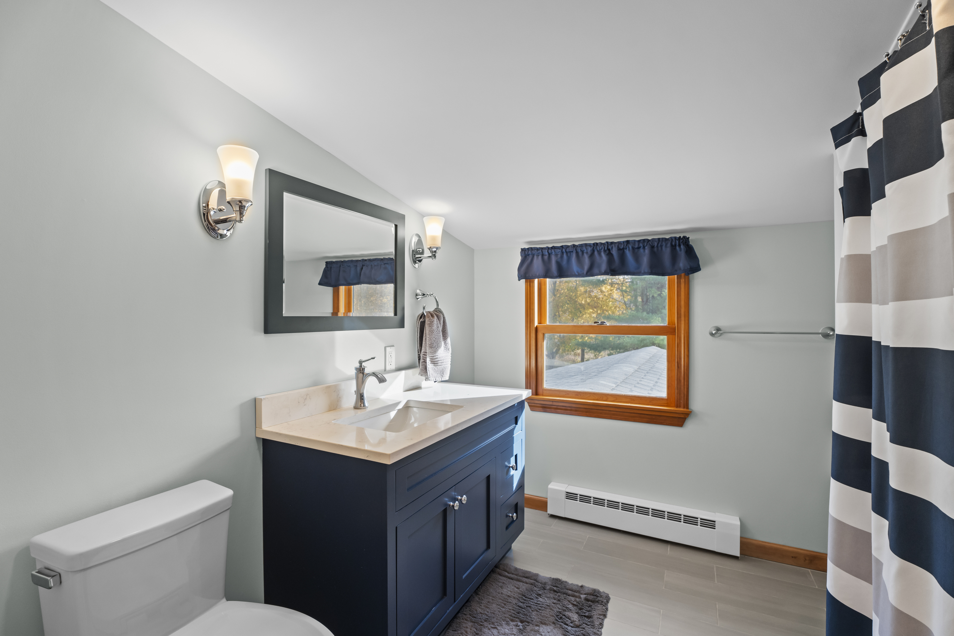 452 Colonel Ledyard Highway Ledyard, CT 06339 - Photo 25 of 35 a bathroom with a double vanity sink and a mirror