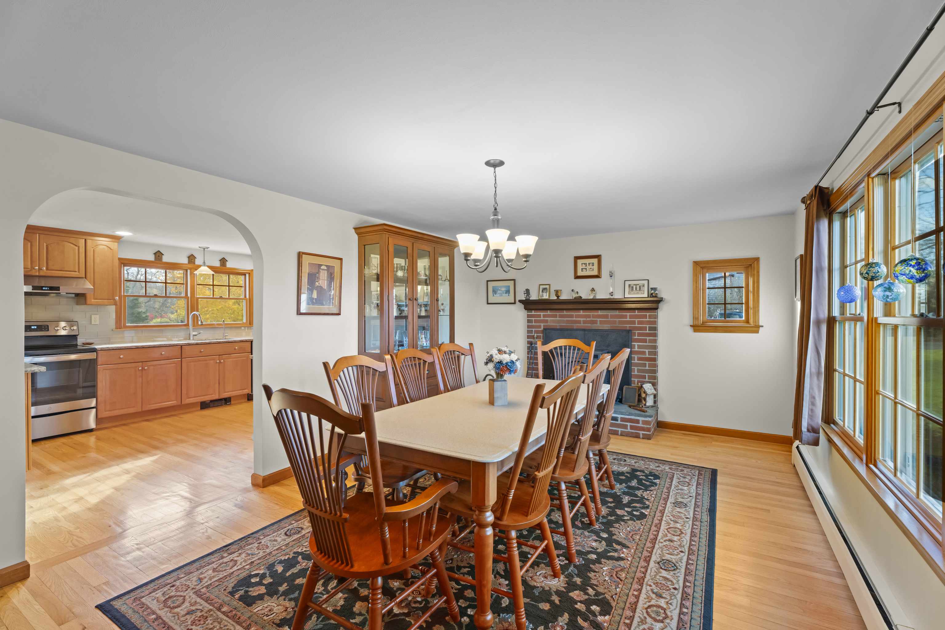 452 Colonel Ledyard Highway Ledyard, CT 06339 - Photo 6 of 35 a dining room with furniture a chandelier and wooden floor