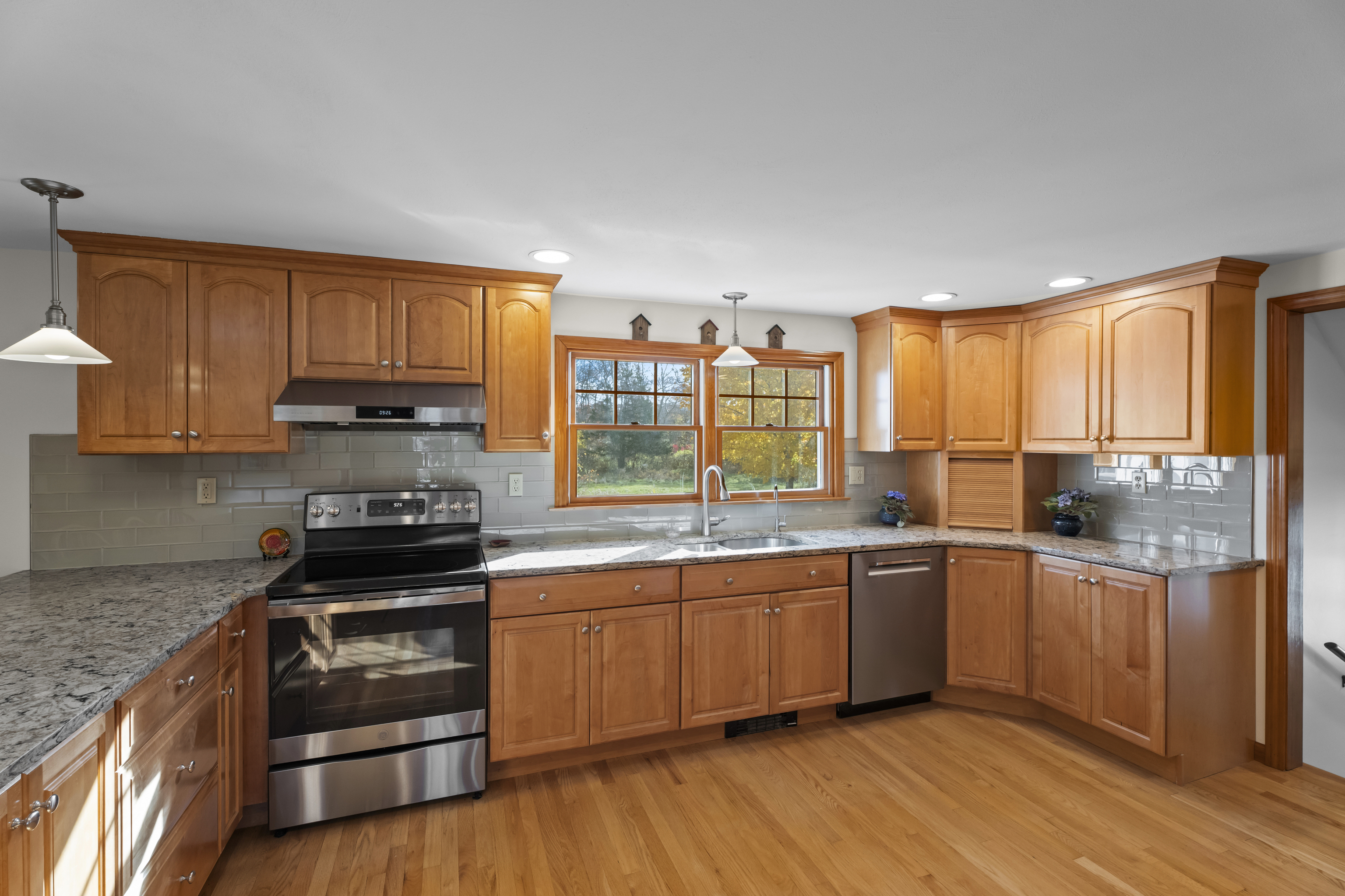 452 Colonel Ledyard Highway Ledyard, CT 06339 - Photo 8 of 35 a kitchen with stainless steel appliances a stove a sink and cabinets