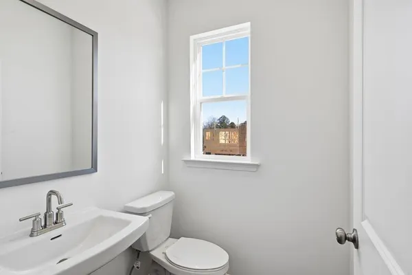 a bathroom with a sink toilet and vanity