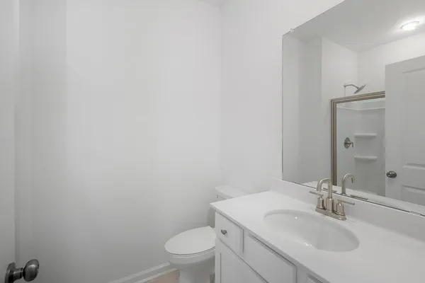 a bathroom with a sink and vanity