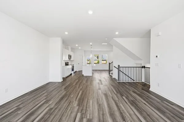 a view of a living room with wooden floor