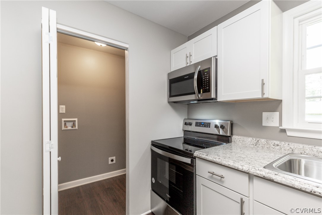 4101 Bronholly Road Chesterfield, VA 23832 - Photo 8 of 24 a kitchen with a sink and a microwave