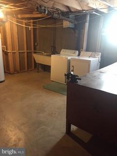1522 Burnfield Road Baltimore, MD 21237 - Photo 16 of 20 a view of storage and utility room with washer and dryer