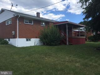 1522 Burnfield Road Baltimore, MD 21237 - Photo 20 of 20 a front view of a house with garden