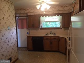 1522 Burnfield Road Baltimore, MD 21237 - Photo 5 of 20 a bathroom with a sink and a mirror
