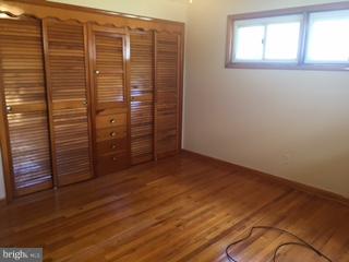 1522 Burnfield Road Baltimore, MD 21237 - Photo 9 of 20 an empty room with windows