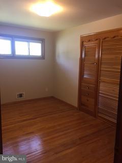 1522 Burnfield Road Baltimore, MD 21237 - Photo 10 of 20 wooden floor in an empty room