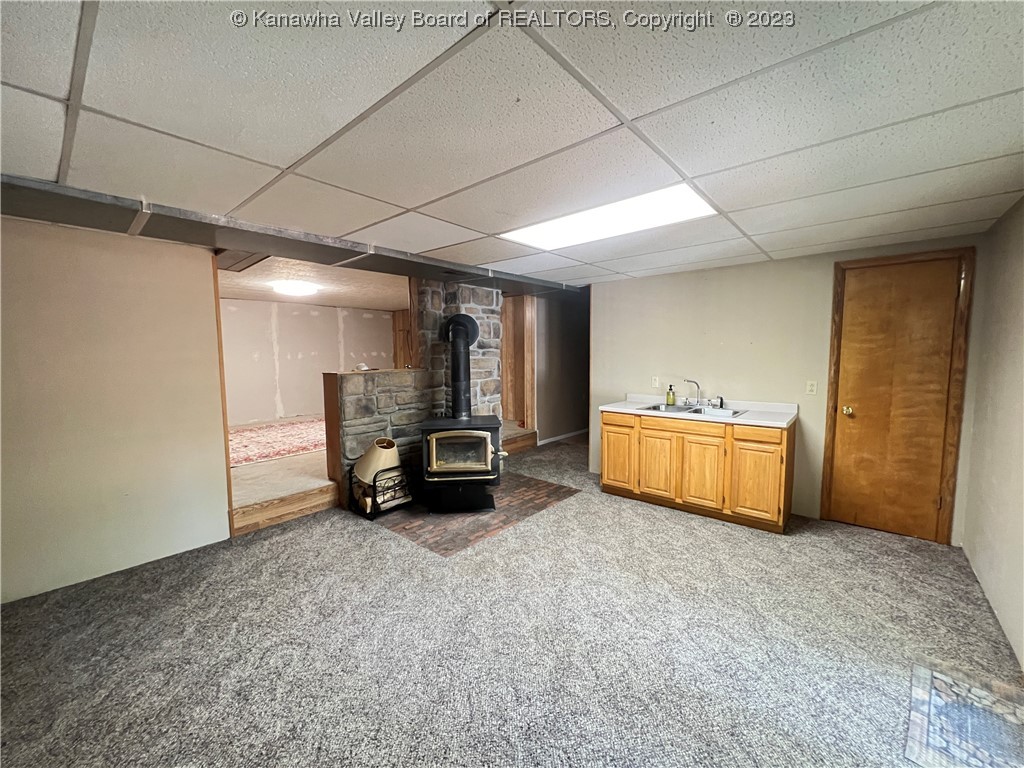 739 Allison Road Point Pleasant, WV 25550 - Photo 29 of 37 basement den with buck woodburning stove