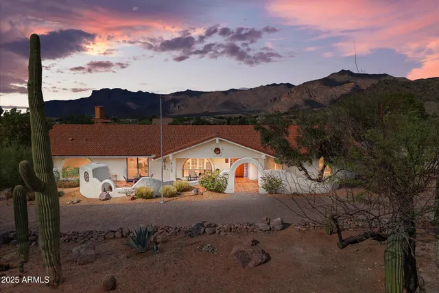 a view of a lake with a house in the background