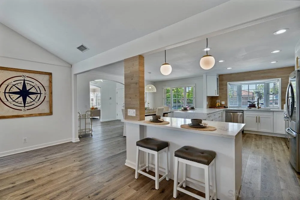 5771 Rutgers Road La Jolla, CA 92037 - Photo 23 of 75 a view of a dining room with furniture window and wooden floor