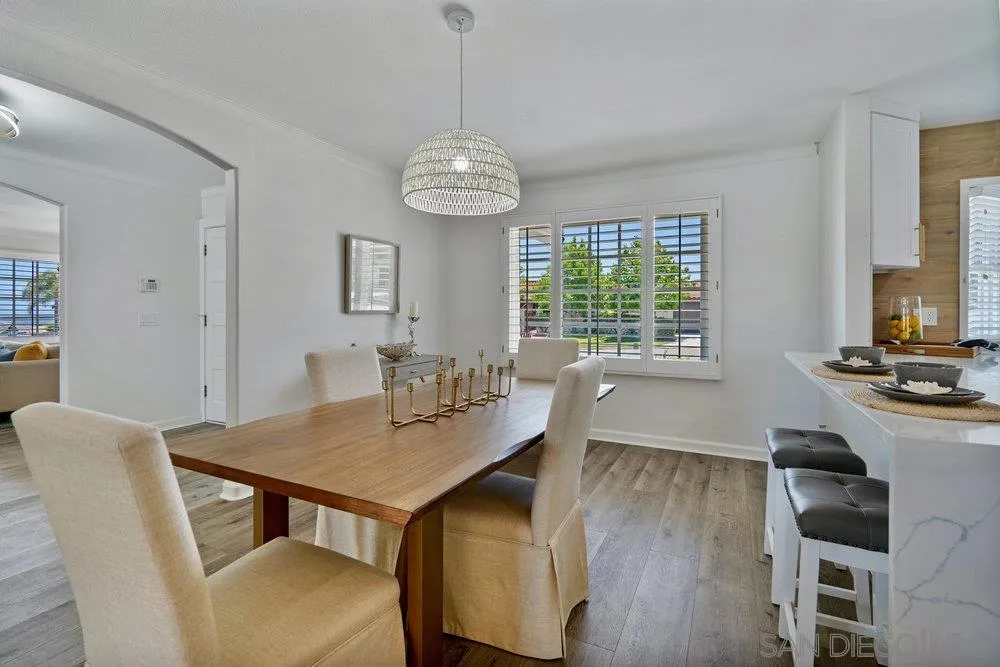 5771 Rutgers Road La Jolla, CA 92037 - Photo 31 of 75 a view of a dining room with furniture window and wooden floor