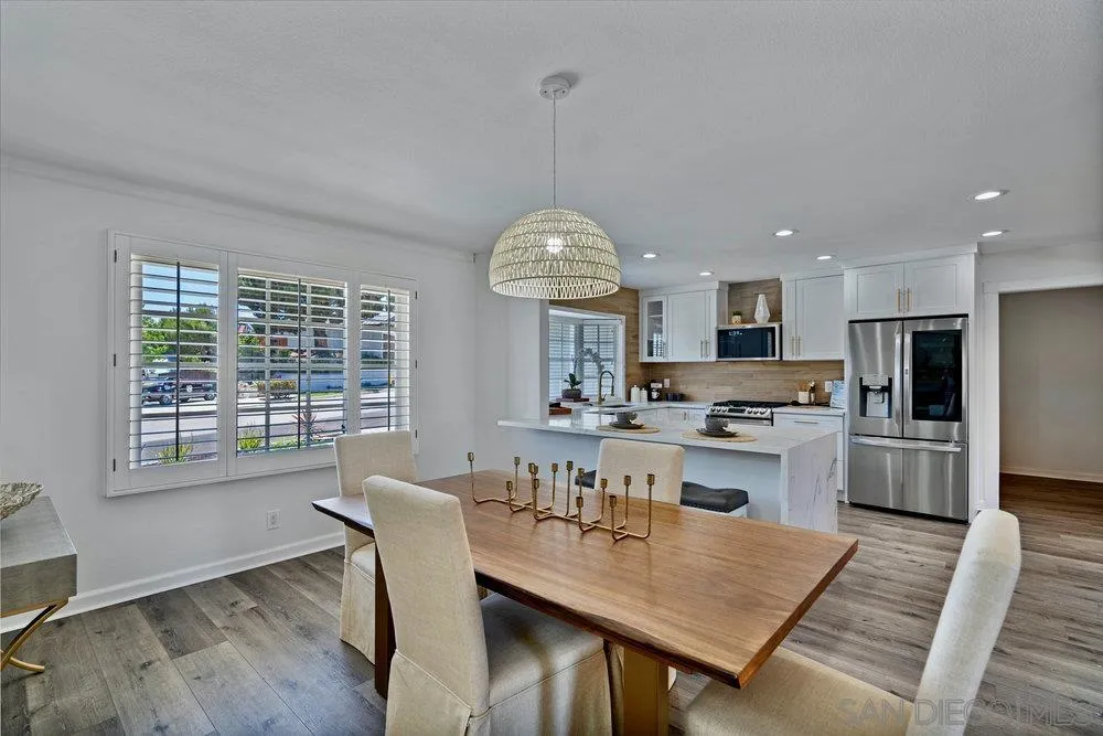 5771 Rutgers Road La Jolla, CA 92037 - Photo 33 of 75 a view of a dining room with furniture window and wooden floor