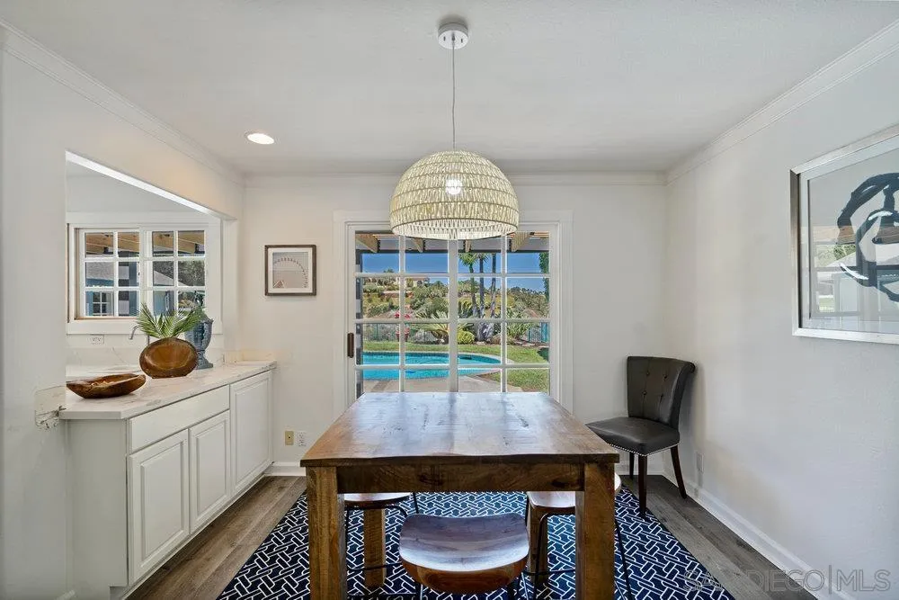 5771 Rutgers Road La Jolla, CA 92037 - Photo 36 of 75 a view of a dining room with furniture and wooden floor