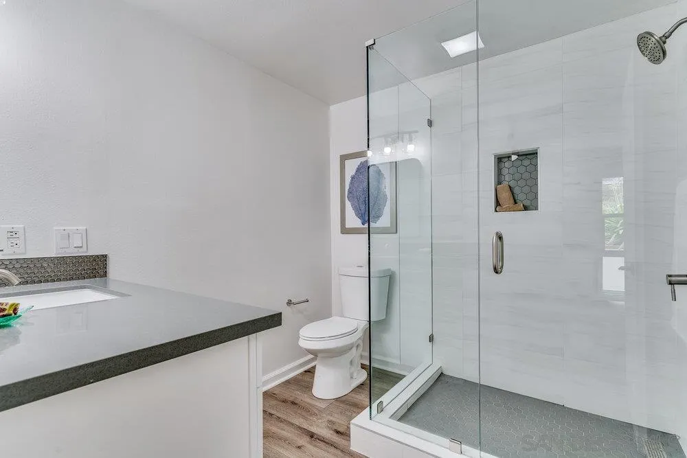 5771 Rutgers Road La Jolla, CA 92037 - Photo 40 of 75 a bathroom with a toilet and a shower