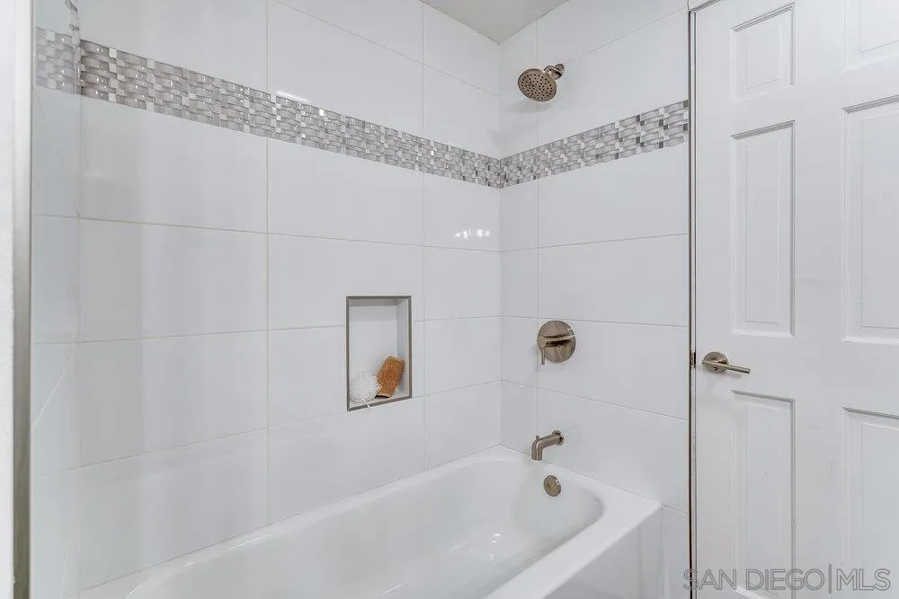 5771 Rutgers Road La Jolla, CA 92037 - Photo 44 of 75 a bathroom with a bathtub and a shower
