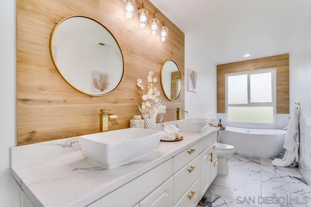 5771 Rutgers Road La Jolla, CA 92037 - Photo 50 of 75 a bathroom with a sink and a mirror