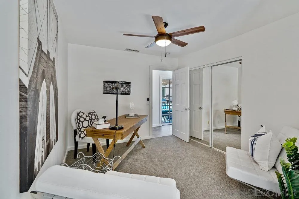 5771 Rutgers Road La Jolla, CA 92037 - Photo 53 of 75 a living room with furniture and a chandelier