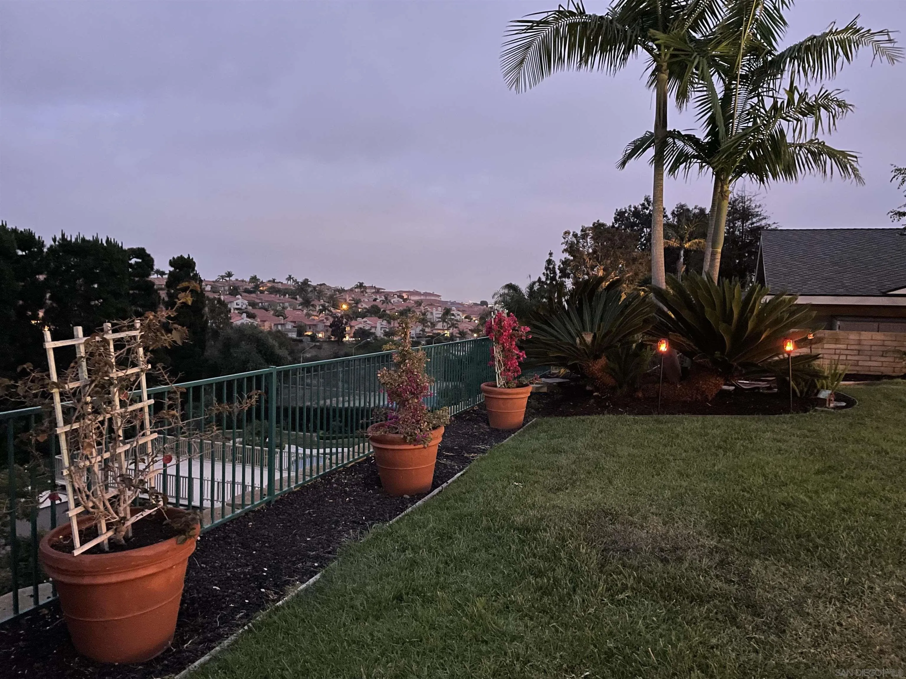 5771 Rutgers Road La Jolla, CA 92037 - Photo 64 of 75 a view of a roof deck with table and chairs potted plants