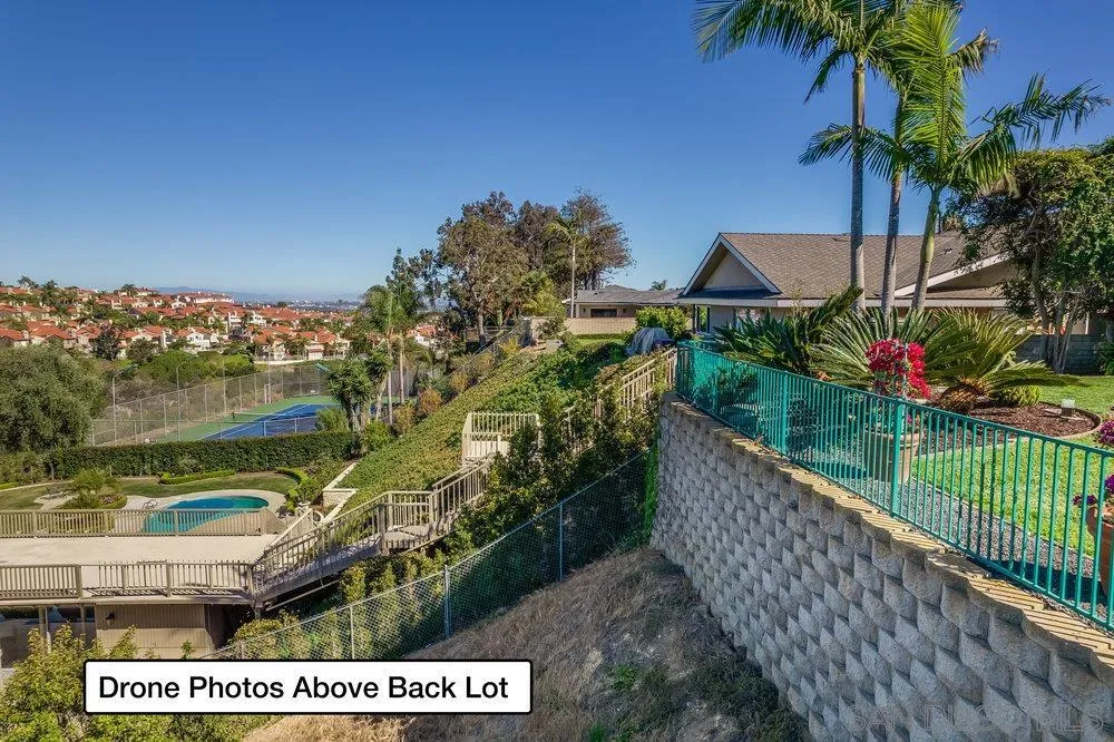 5771 Rutgers Road La Jolla, CA 92037 - Photo 72 of 75 a view of a house with a yard and potted plants