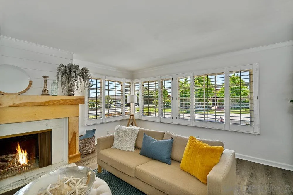 5771 Rutgers Road La Jolla, CA 92037 - Photo 9 of 75 a living room with furniture and a fireplace