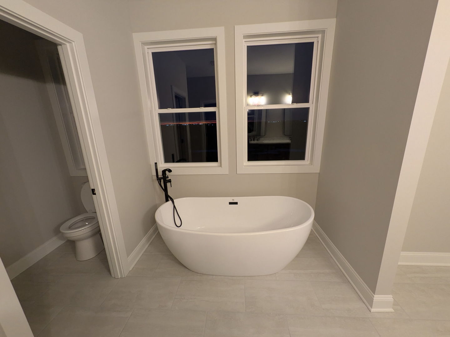 675 South Regulators Street Rochelle, IL 61068 - Photo 16 of 26 a white bath tub sitting in a bathroom