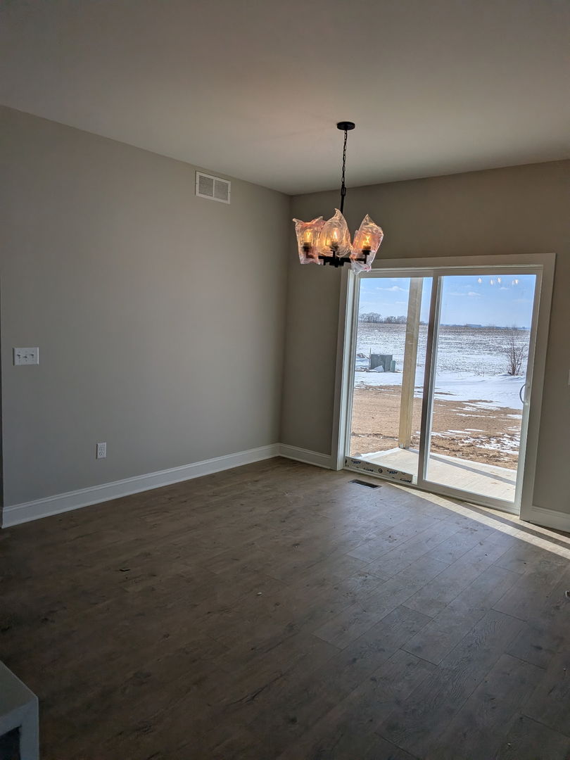 675 South Regulators Street Rochelle, IL 61068 - Photo 21 of 26 a view of an empty room with a window