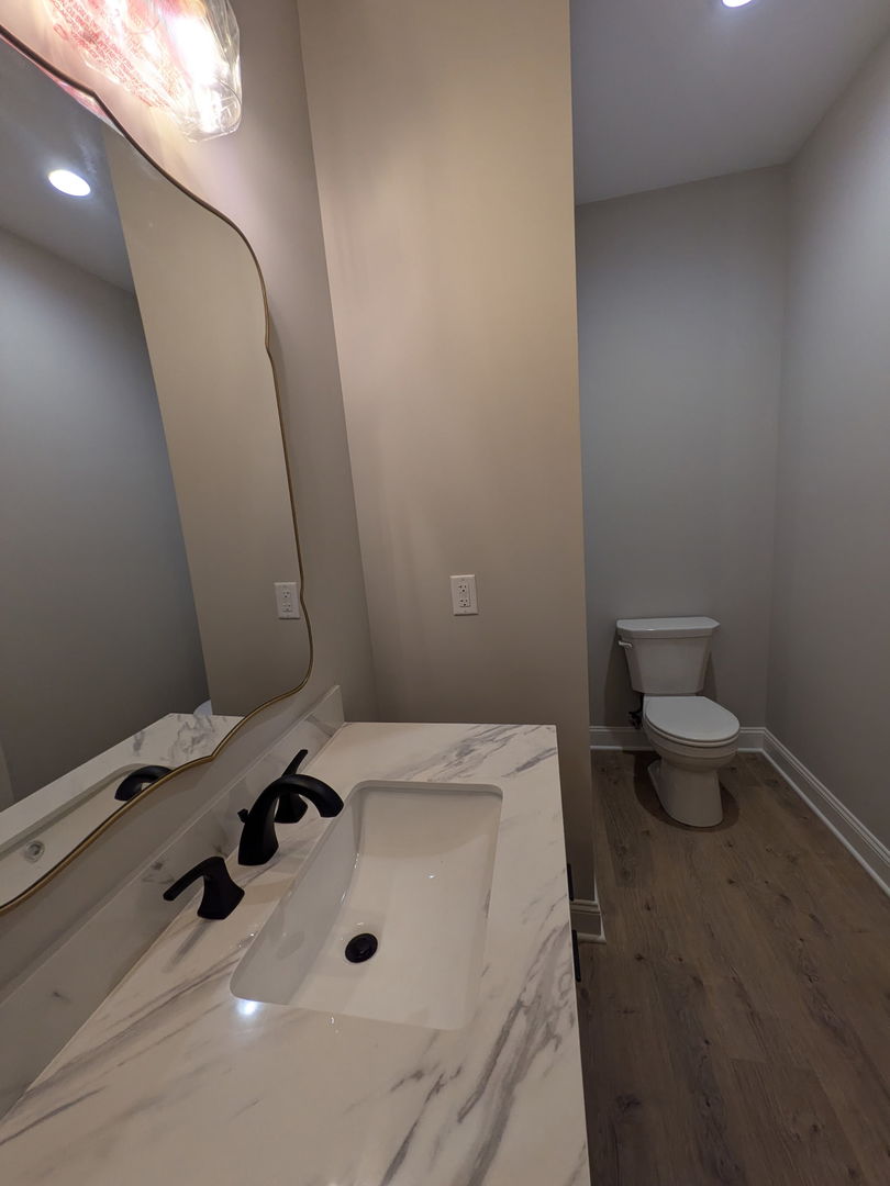 675 South Regulators Street Rochelle, IL 61068 - Photo 25 of 26 a bathroom with a sink and a toilet
