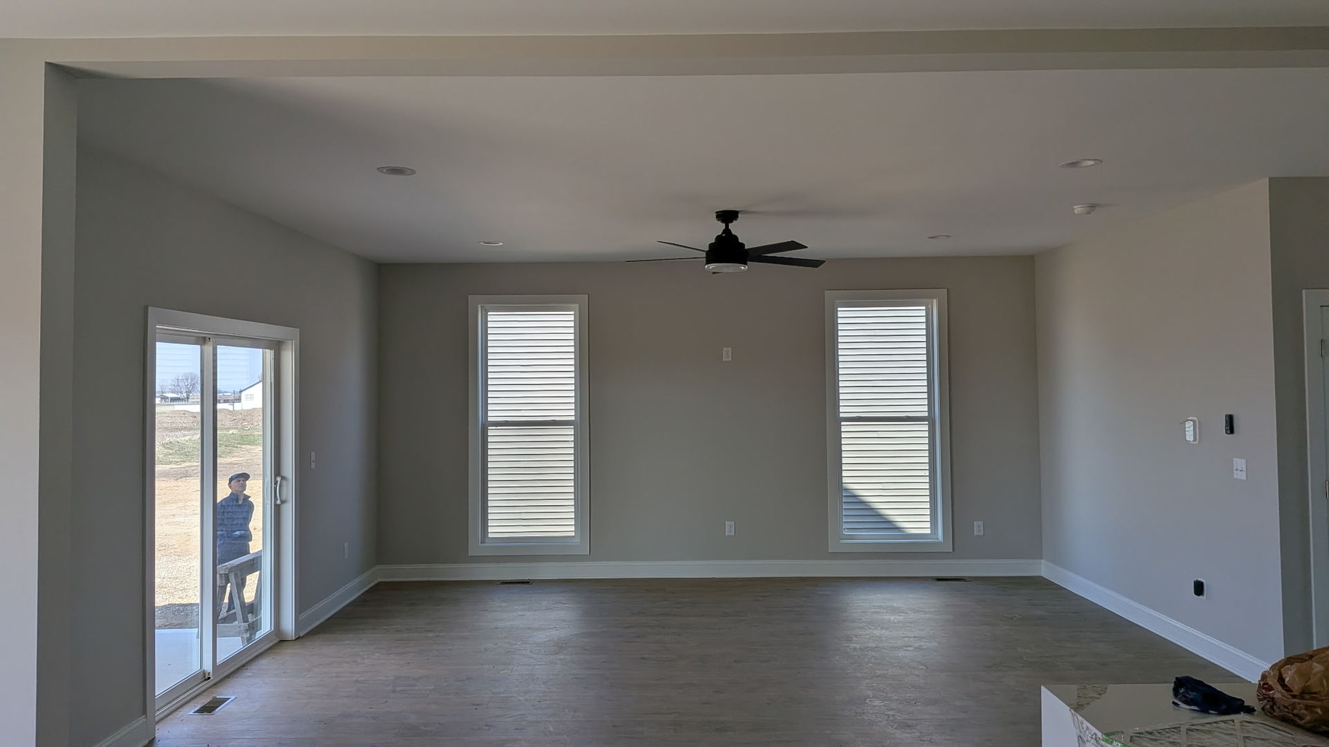 675 South Regulators Street Rochelle, IL 61068 - Photo 6 of 26 an empty room with wooden floor cabinet and windows