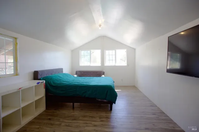 a room with a bed and a window