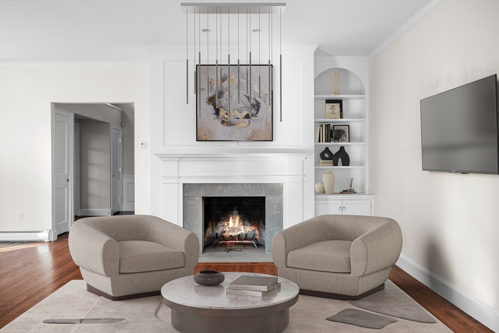349 Ocean Avenue Marblehead, MA 01945 - Photo 6 of 23 a living room with furniture and a fireplace