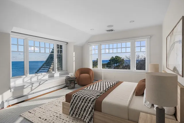 a living room with a couch and a large window