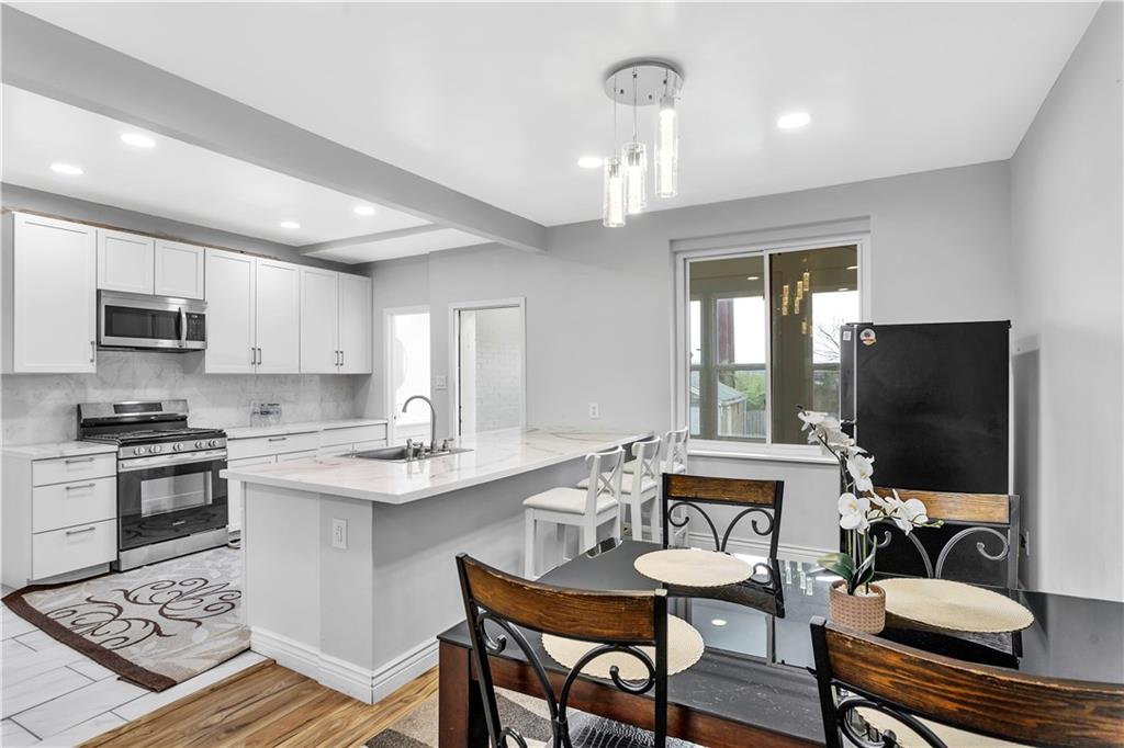 25 Clearview Avenue Duquesne, PA 15110 - Photo 14 of 33 a view of kitchen with cabinets dining table and chairs