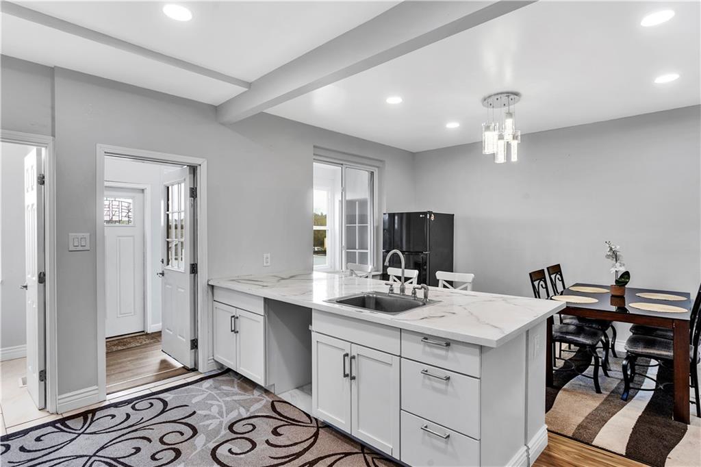 25 Clearview Avenue Duquesne, PA 15110 - Photo 16 of 33 a bathroom with a double vanity sink a mirror and a shower