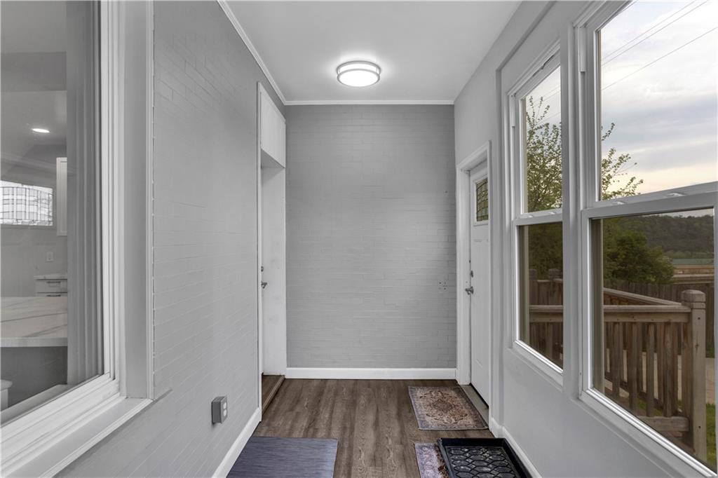 25 Clearview Avenue Duquesne, PA 15110 - Photo 19 of 33 a view of hallway with a large window and wooden floor