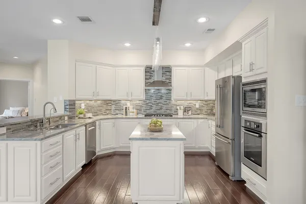 a view of a dining room with furniture and windows