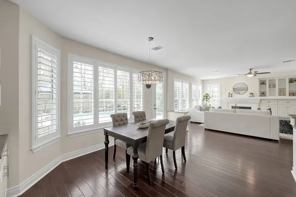 a spacious bedroom with a bed and ceiling fan