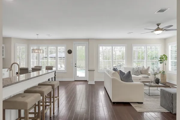 a bathroom with a sink double vanity granite tub and a mirror