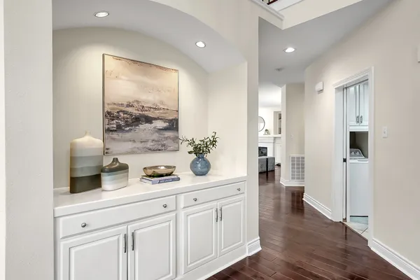 a view of a dining room with furniture wooden floor and chandelier