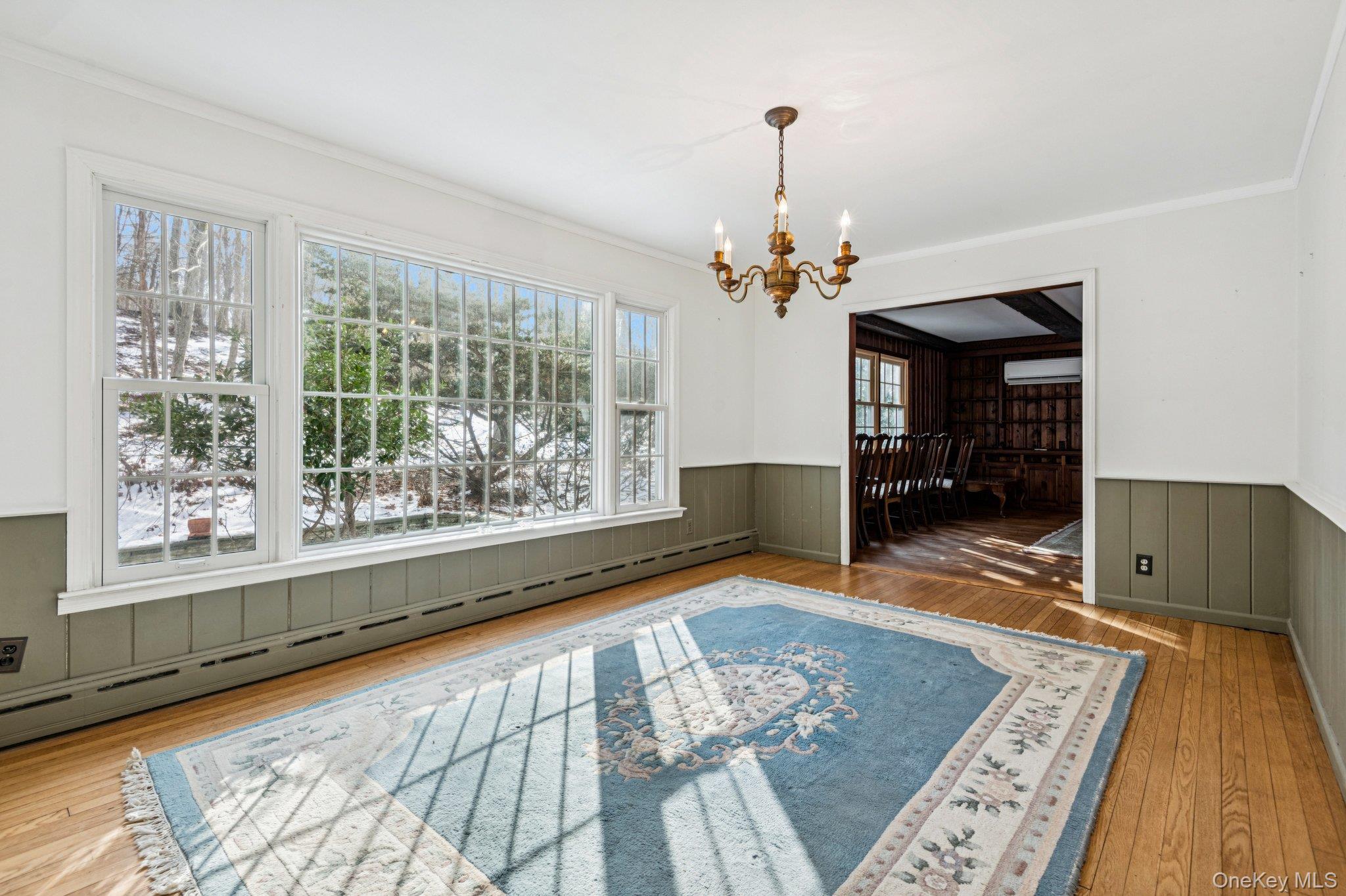 1 Spring Hollow Road St. James, NY 11780 - Photo 11 of 30 a view of an empty room with a window and wooden floor
