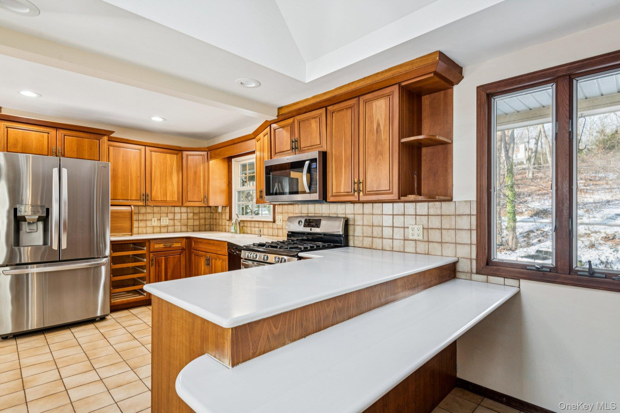 1 Spring Hollow Road St. James, NY 11780 - Photo 14 of 30 a kitchen with a refrigerator a stove a sink and a microwave