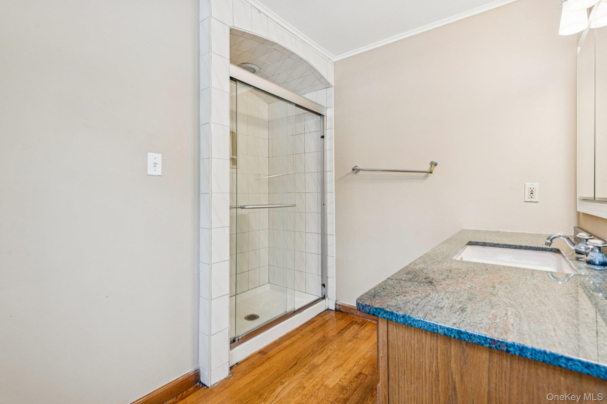 1 Spring Hollow Road St. James, NY 11780 - Photo 21 of 30 a bathroom with a granite countertop sink and a mirror