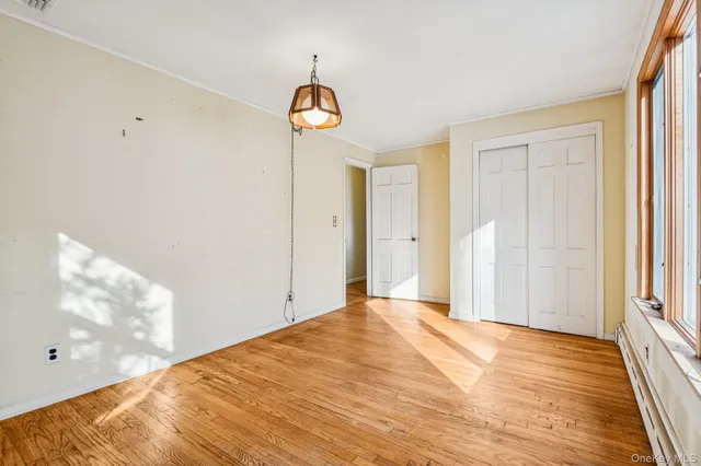 a bathroom with a granite countertop sink and a window