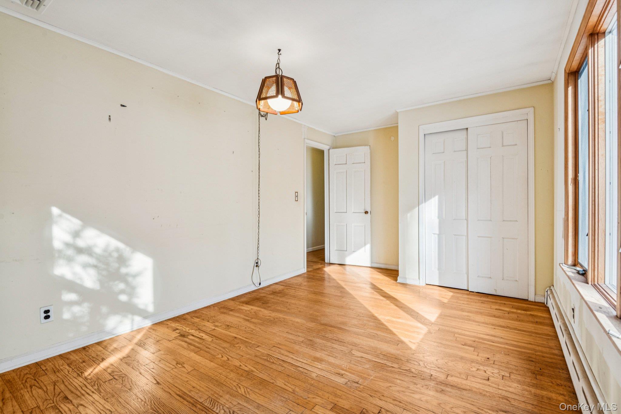 1 Spring Hollow Road St. James, NY 11780 - Photo 23 of 30 a view of a room with wooden floor and a window