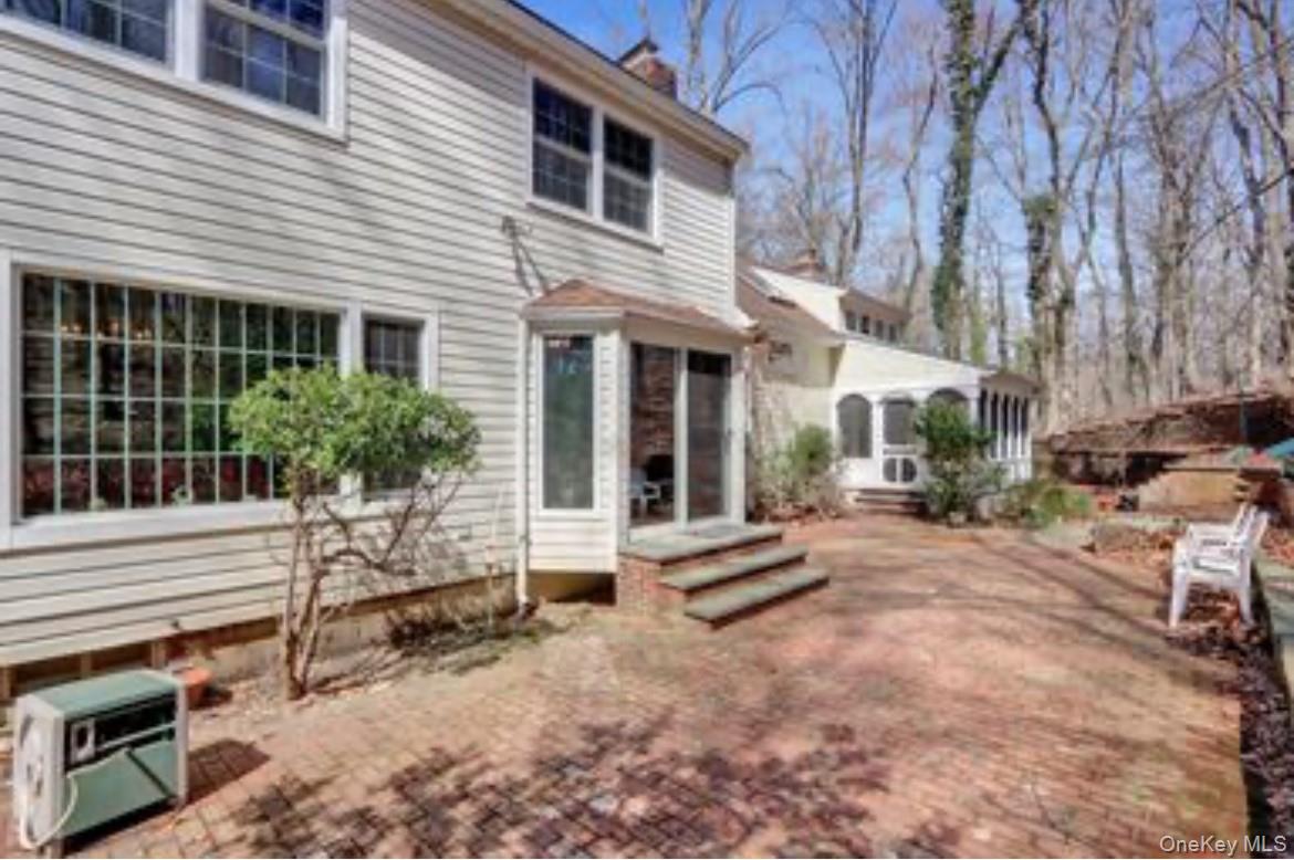 1 Spring Hollow Road St. James, NY 11780 - Photo 30 of 30 a view of a house with backyard and sitting area
